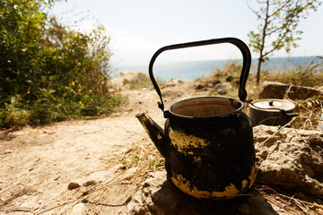 Kettle in a tent camp. Travel and adventure time.
