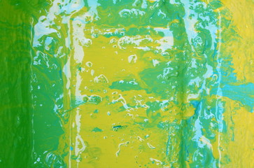 beautiful yellow-blue-green background of mixed blurred oil paints