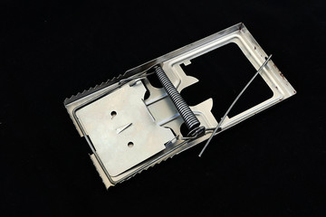mousetrap on black background. Isolated 3D image,
