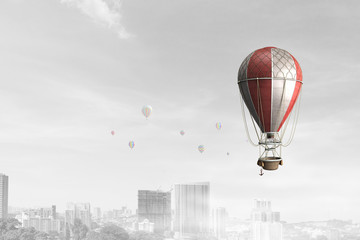 Fototapeta na wymiar Air balloon in blue sky. Mixed media