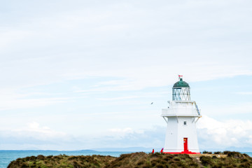 Fototapeta na wymiar Waipapa point, the lighthouse, ocean and cloudy.