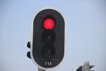 Red traffic light on a crossing in the netherlands.