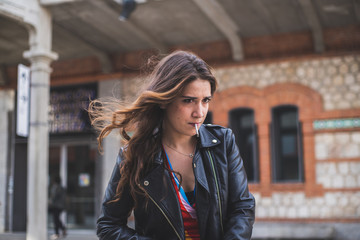 woman on the street with smoking a cigarette