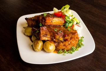 Dish with pork ribs and vegetables