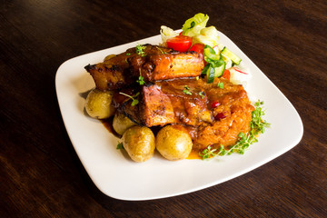 Dish with pork ribs and vegetables