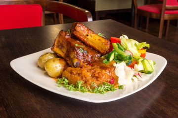 Dish with pork ribs and vegetables