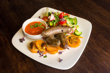 Fried sausages and salad