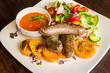Fried sausages and salad