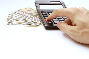 Hand use calculator on the office desk  investment and property for concept