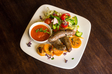 Fried sausages and salad