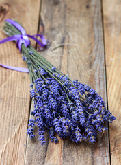 Bouquet of lavender on an old wooden table. Rustic style. Top view and copy space