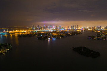 Aerial far shot Downtown Miami at night Biscayne Bay