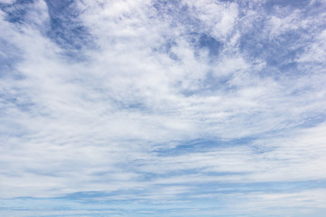 Transparent blue sky with clouds and atmospheric afternoon.
