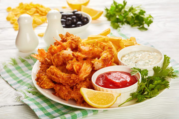 fried shrimps with french fries and coctail sauce