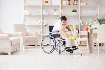 Disabled man cleaning floor at home