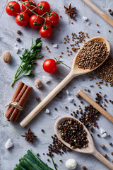 Culinary still life of assorted spices on white textured background, flat lay, close-up, selective focus.