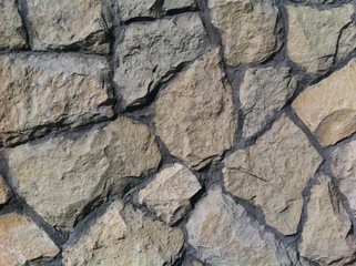 Decorative natural stone. Natural decoration of the facade of the house, building
