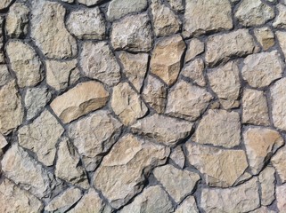 Decorative natural stone. Natural decoration of the facade of the house, building