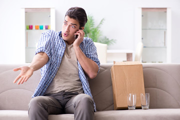 Man receiving wrong parcel with glasses