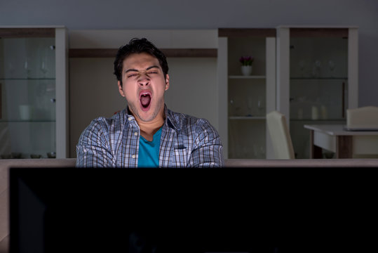 Young Man Watching Tv Late At Night