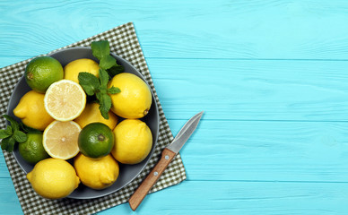 Lemons on a plate on a blue background. With space for text