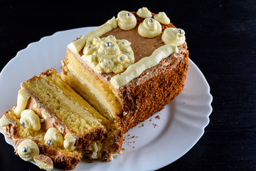 delicious home made biscuit cake on a black background