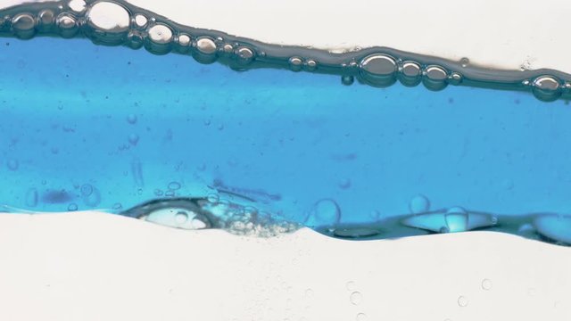 oily eye makeup remover texture Close Up of two unmixable liquids