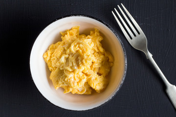 Scrambled eggs in bowl close up - Top view photo