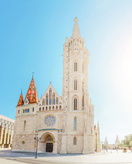 Naklejka premium Main tourist attraction and landmark of Budapest - amazing architecture of the Cathedral of St. Matthias. Church is the biggest gothic temple in Hungary.