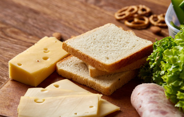 Concept of school lunch break with healthy lunch box and school supplies on wooden desk, selective focus.