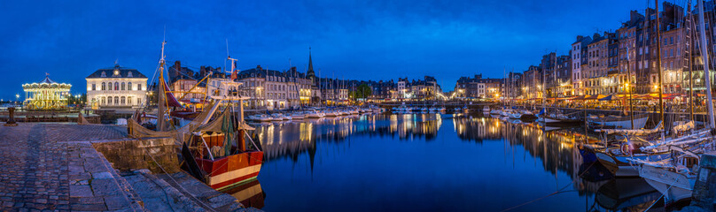 Panoramic view at dusk of the beautiful Honfleur harbour, which offers many fine restaurants...