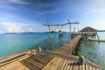 Fototapeta na wymiar wooden bridge and cottage on tropical sea in Koh Mak island, Trat province,Thailand