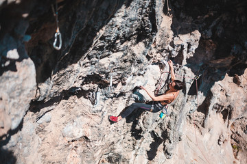 A climber climbs the rock.