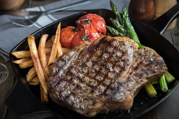 grilled rib eye steak on pan