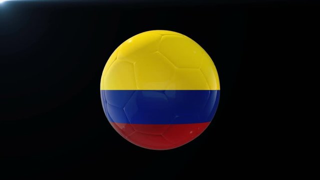 Football with flag of Colombia, soccer ball with Colombian flag, sports equipment rotating on black background, 3D animation