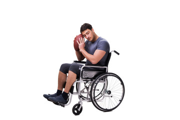 Obraz na płótnie Canvas Football player recovering from injury on wheelchair