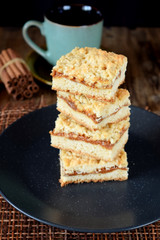 Pieces of grated pie with caramel