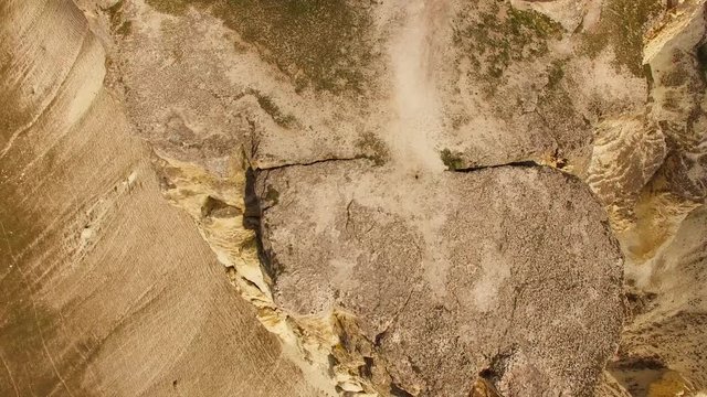 Raised from the ground rocky plateau, steeply outlined by chalk cliffs of rocks. bird's eye view.