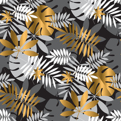 Gold and black vibrant tropical leaves seamless pattern