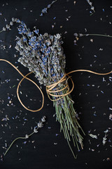 Dried lavender on black table. Traditional lavender flower drying.