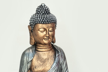 closeup of buddha statue on white background