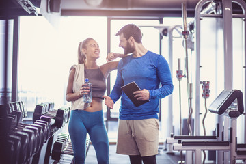 Smiling talk at gym.