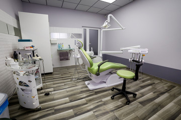 Modern dentistry office interior with chair and tools - medicine, medical equipment and stomatology concept