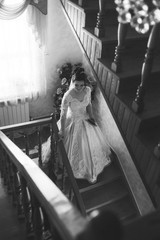 Beautiful bride standing on a stairs