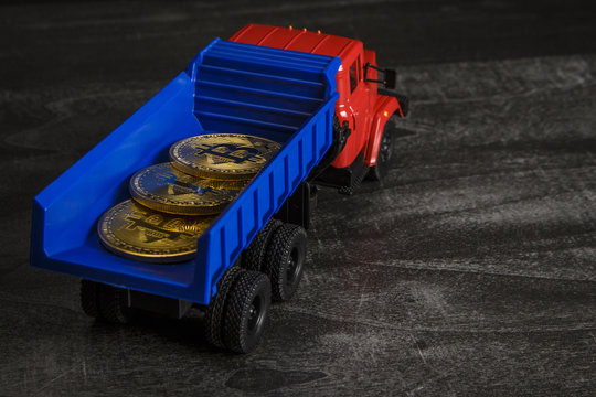 Coins in the form of bitcoin in a toy truck
