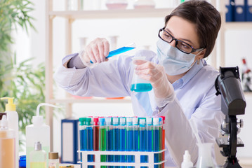 Female chemist working in hospital lab