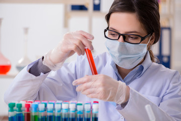 Female chemist working in hospital lab