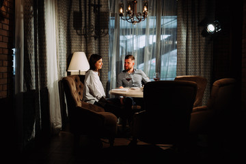 Dating concept, couple drinking wine in a restaurant