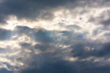 Dark storm clouds in the sky. Blurring background. Bright colors.