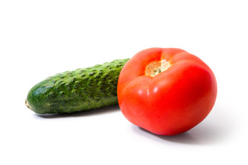 Red juicy tomato and green cucumber. Summer vegetables. Healthy food.